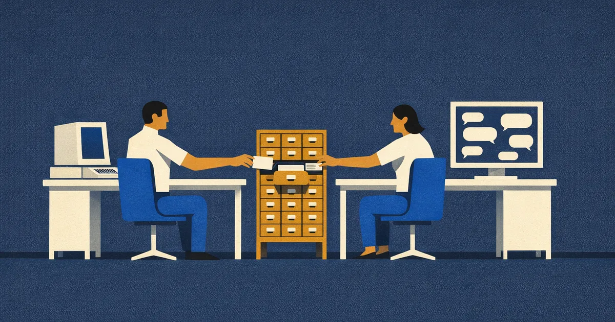 Two desks face each other across a room, a terminal on one and a chat screen on the other. Between them stands a single card-catalogue cabinet with one drawer pulled open, and a person at each desk reaches toward it.